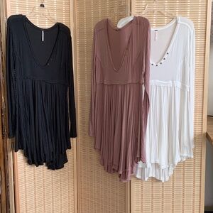 Free People three tunics sold separately.  Black/gray,  mauve and white.